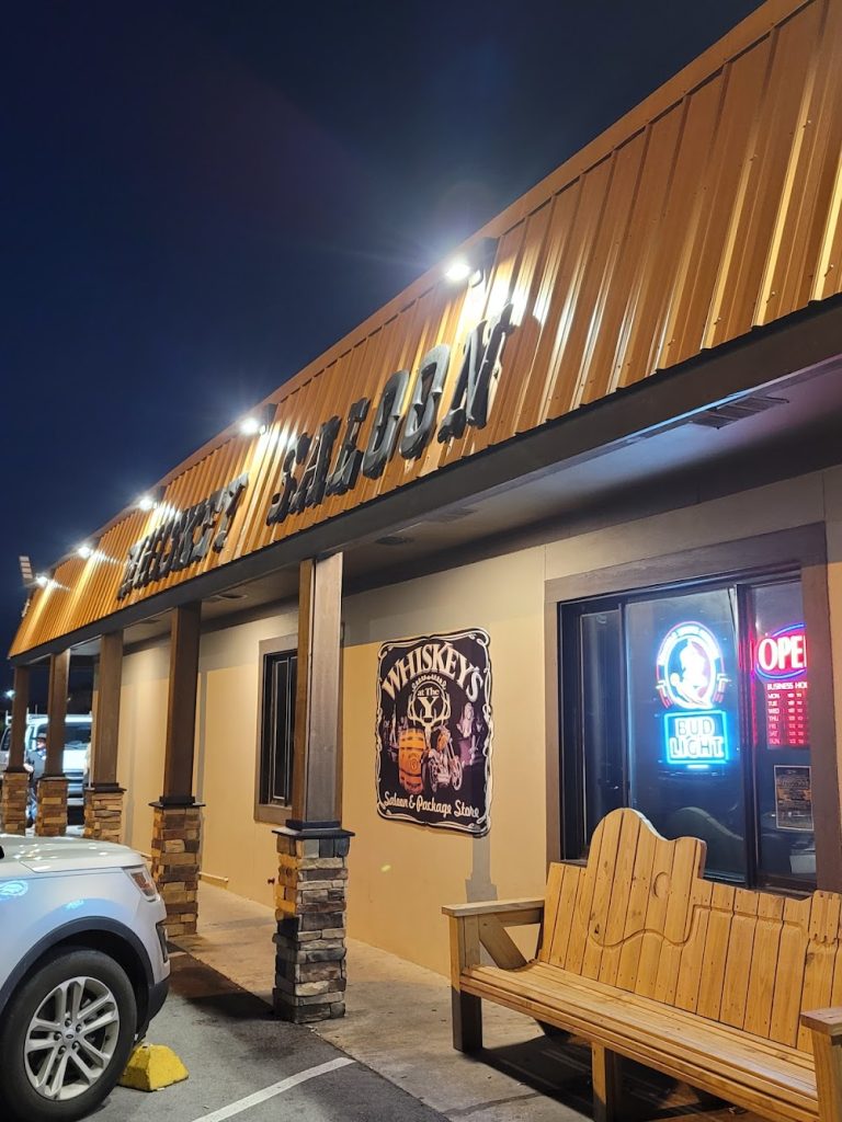 Whiskey's Saloon exterior lit up at night on Front Beach Road in Panama City Beach