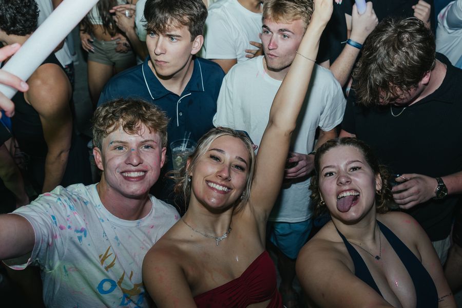 Friends cheering together on the dance floor