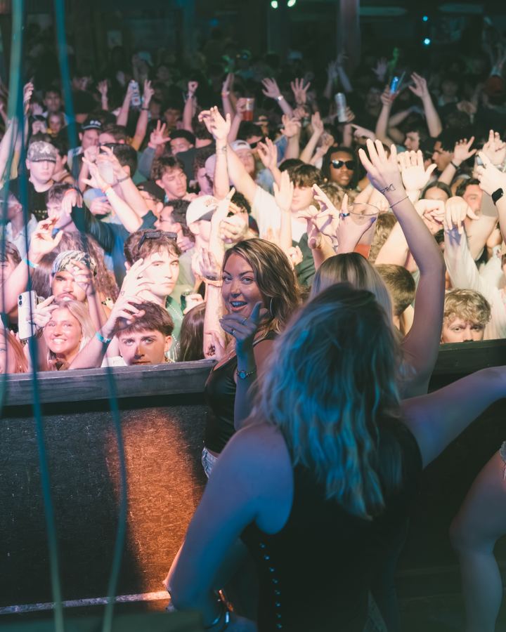 Crowd with hands up at a Spring Break party