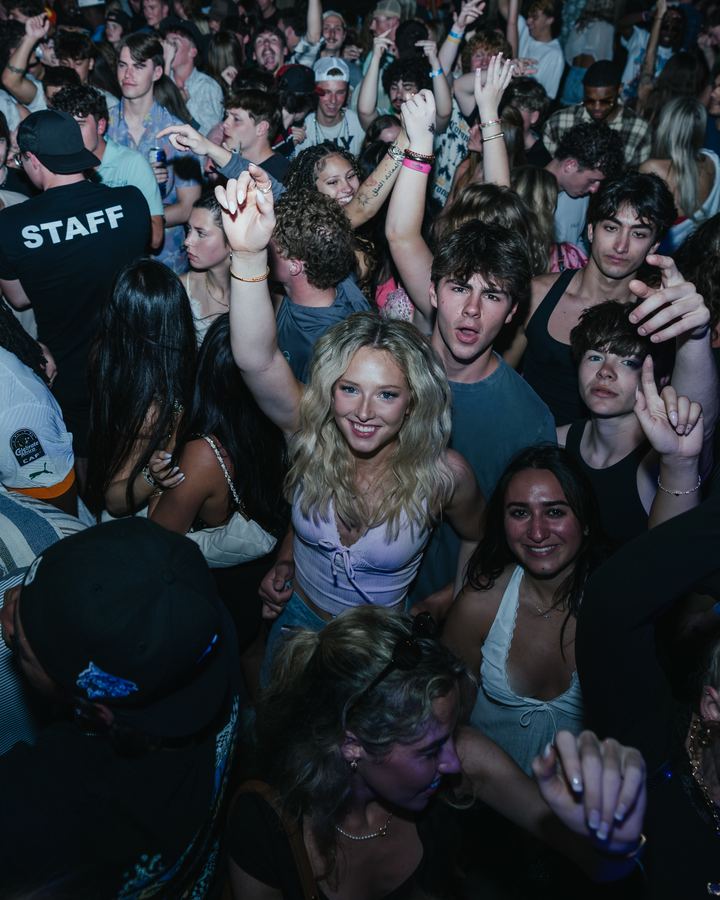 Crowd cheering at a Spring Break party
