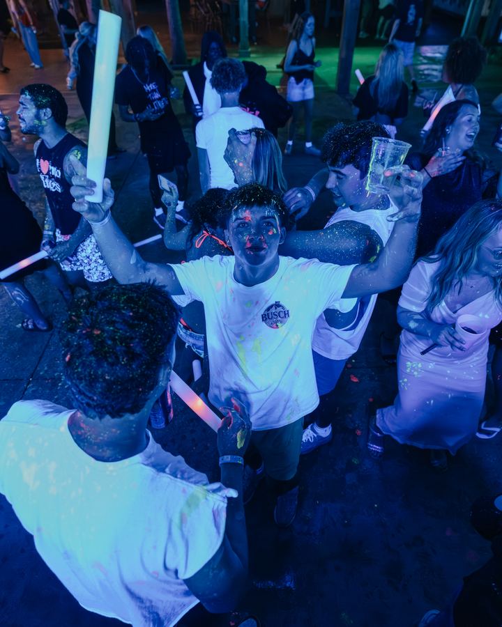 Crowd dancing with glow sticks