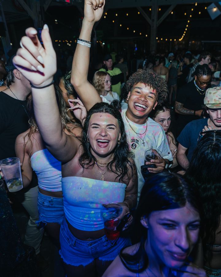 Crowd cheering at a Spring Break party